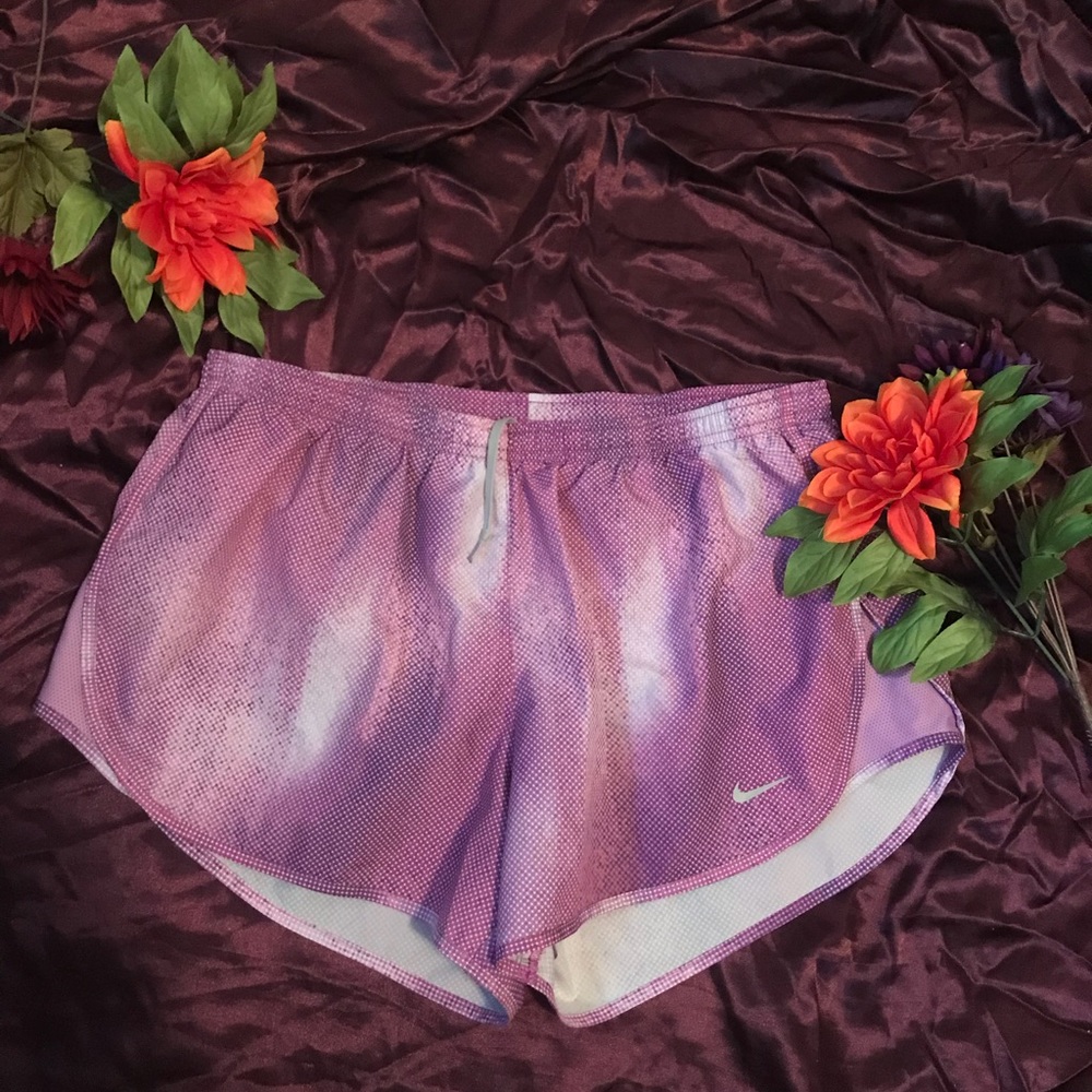 Purple and white Nike shorts.
